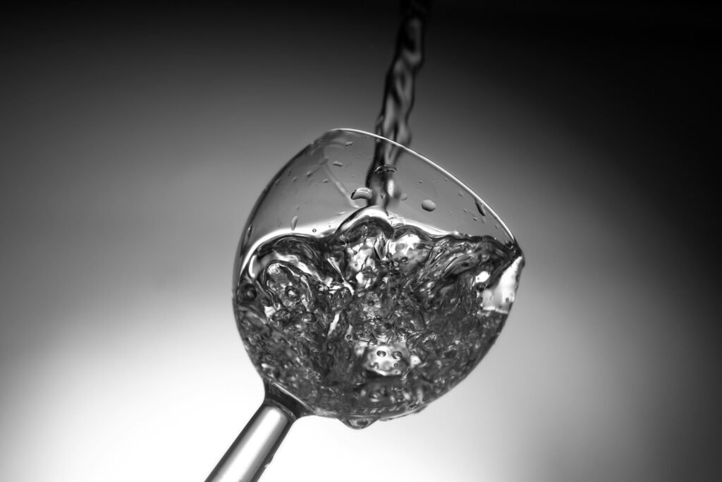 Unlock Your Strength: Optimizing Post-Workout Recovery 3 water poured on wine glass